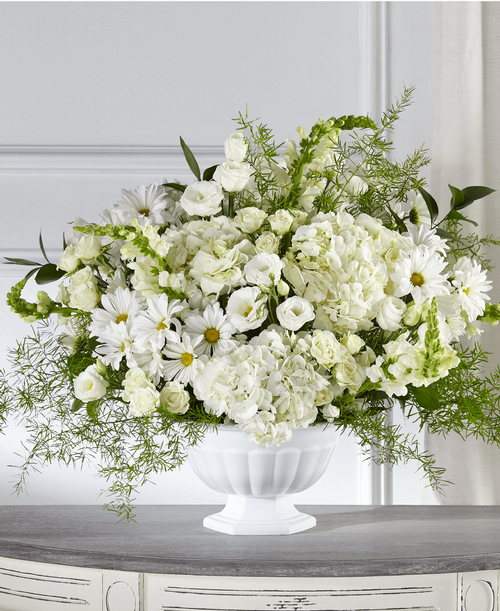 During times of sensitivity, remind those you care about that they are in your heart with our Love & Compassion Arrangement. This display of elegant white flowers is crafted by a local florist, ensuring your condolences are thoughtfully designed and delivered with care. 
- Details:
Good bouquet is approximately 20 inchH x 30 inchW 
Better bouquet is approximately 21 inchH x 30 inchW 
Best bouquet is approximately 23 inchH x 32 inchW
