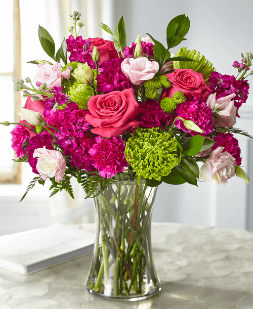 Share your love and sympathies with our Everlasting Embrace Bouquet. A collection of roses, lisianthus, stock and Fuji mums are crafted in a clear vase t evoke the same warmth that comes from a comforting embrace. This bouquet is simply sweet in size and best suited for a small table, home or residence.
- Details:
Good bouquet is approximately 17 inchH x 16 inchW 
Better bouquet is approximately 18 inchH x 17 inchW 
Best bouquet is approximately 20 inchH x 19 inchW 