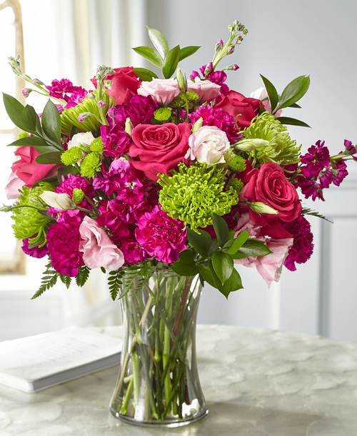 Share your love and sympathies with our Everlasting Embrace Bouquet. A collection of roses, lisianthus, stock and Fuji mums are crafted in a clear vase t evoke the same warmth that comes from a comforting embrace. This bouquet is simply sweet in size and best suited for a small table, home or residence.
- Details:
Good bouquet is approximately 17 inchH x 16 inchW 
Better bouquet is approximately 18 inchH x 17 inchW 
Best bouquet is approximately 20 inchH x 19 inchW 