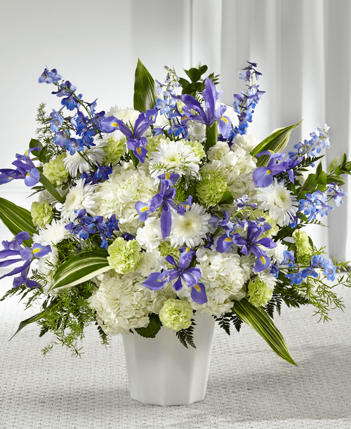 Designed with a fresh mix of blue and white flowers, this tribute is crafted t bring peace t a loved one while they grieve. Our local florists craft iris, hydrangea, delphinium and cremon mums in our Soft Serenity Floor Basket t remind your loved one of how much you care for them. 
Good basket is approximately 26 inchH x 25 inchW 
Better basket is approximately 29 inchH x 28 inchW 