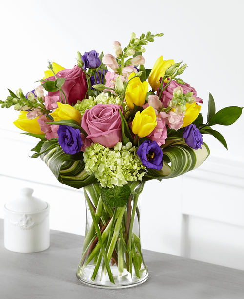 The freshness of bright spring flowers brings comfort and peace t those celebrating the beautiful life of someone they lost. Within our Wondrous Memories Bouquet, your messages of sympathy are complemented with bursting tulips, roses, hydrangea and double lisianthus in radiant garden hues. 
Good bouquet is approximately 17 inchH x 13 inchW 
Better bouquet is approximately 17 inchH x 14 inchW 
Best bouquet is approximately 18 inchH x 15 inchW