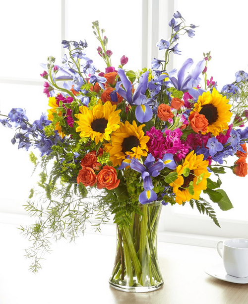 Show your loved ones how much you care about them with a beautiful bouquet full of bright florals. 25 inchHx26 inchW