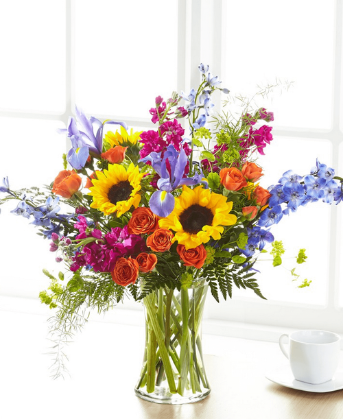 Show your loved ones how much you care about them with a beautiful bouquet full of bright florals. 22 inchHx24 inchW