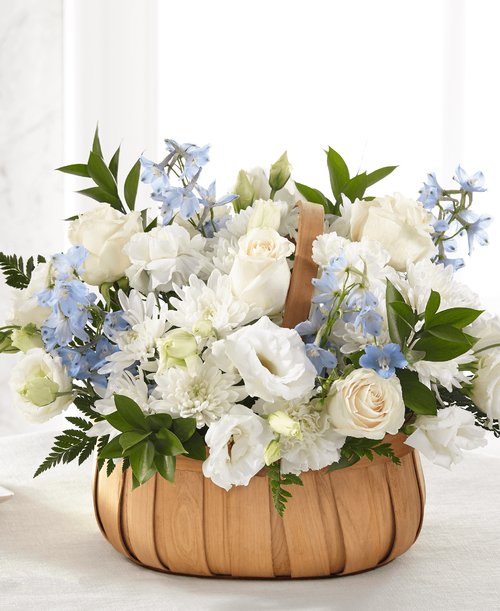 Fresh blue and white flowers are designed t share your heartfelt thoughts for the loss of a loved one. Our local florists beautifully craft roses, lisianthus and delphinium t create the loving sentiment that is sent with our Sincerely Heartfelt Basket. 
Good basket is approximately 12 inchH x 16 inchW 
Better basket is approximately 13 inchH x 17 inchW 
Best basket is approximately 14 inchW x 18 inchW 