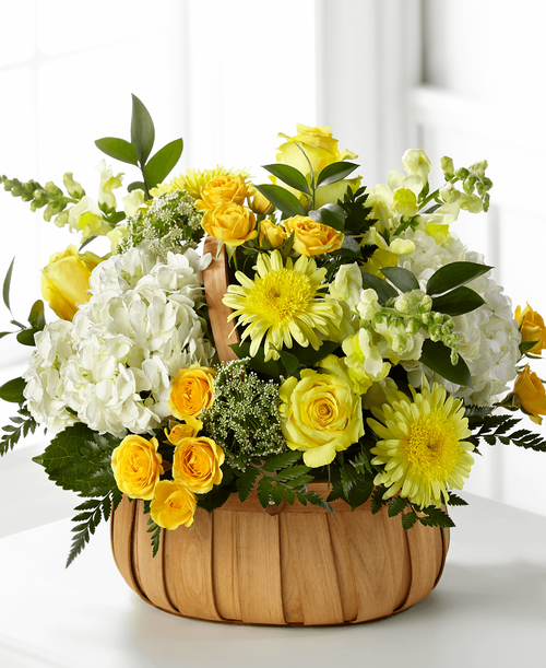Our Rustic Remembrance Basket is designed t share an expression of hope, grace and comfort within each yellow bloom. This bright and uplifting arrangement is crafted with hydrangea, roses and Queen Anne’s Lace by a local florist. While it is perfectly sweet in size, it is best suited for a small table or within a residence.
Good basket is approximately 13 inchH x 14 inchW 
Better basket is approximately 14 inchH x 16 inchW 
Best basket is approximately 16 inchH x 20 inchW