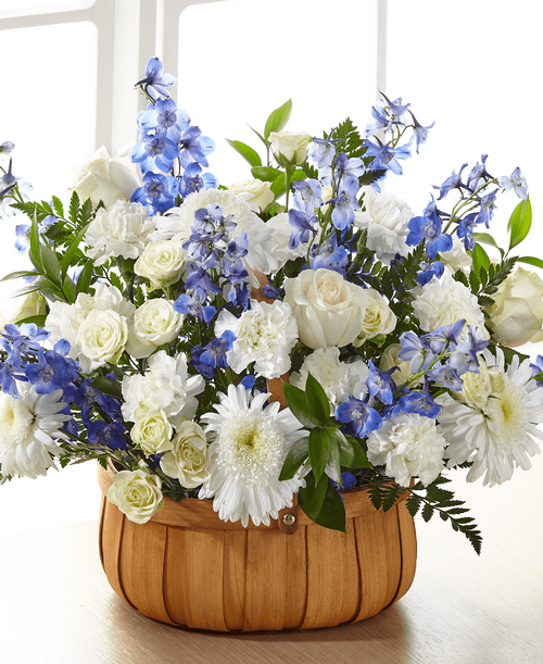 Crafted with a modern mix of blooms, our Harmony & Grace Basket shares peace, harmony and solace t a grieving loved one. While the bouquet is crafted with an elegant collection of roses, delphinium and carnations, it is your sentiment that truly brings this arrangement together. While this arrangement is effortlessly beautiful, it is best suited t be placed on a table or stand. 
- Details:
Good basket is approximately 14 inchH x 20 inchW 
Better basket is approximately 15 inchH x 20 inchW 
Best Basket is approximately 16 inchH x 23 inchW 