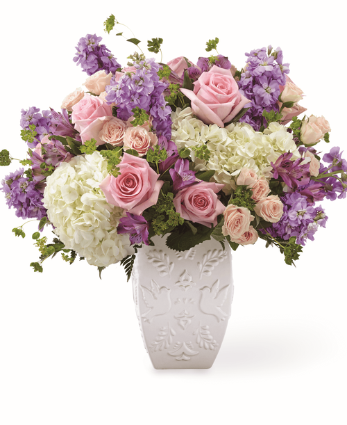 Send your condolences with a stunning arrangement that includes with hydrangea, spray roses and stock. Each gorgeous flower in our FTD Peace and Hope Lavender Bouquet is complimented by an elegant dove and leaf patterned vase to lift them up.
- Details: 
o Good bouquet is approximately 15 inchH x 16 inchW 
o Better bouquet is approximately 17 inchH x 18 inchW 
o Best bouquet is approximately 18 inchH x 20 inchW 