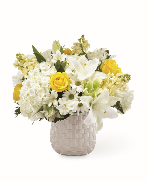 During times of sensitivity, share your thoughts and love with an arrangement that captures your sentiment. Our Comfort and Grace Bouquet is filled with a collection of white and yellow hydrangea blooms, lilies, stock, roses and more. Each bloom is elegantly complemented by a timeless grey basket weave patterned vase. Good bouquet is approximately 17 inchH x 18 inchW 
Better bouquet is approximately 18 inchH x 20 inchW 
Best bouquet is approximately 20 inchH x 22 inchW 
