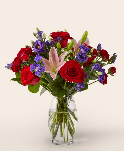 This dreamy jewel toned bouquet combines bold color and eye catching texture to make a statement. 17 inchHx15 inchW